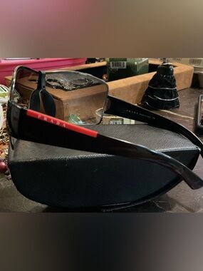 Prada Men's Black Frames with Red Temple Accents